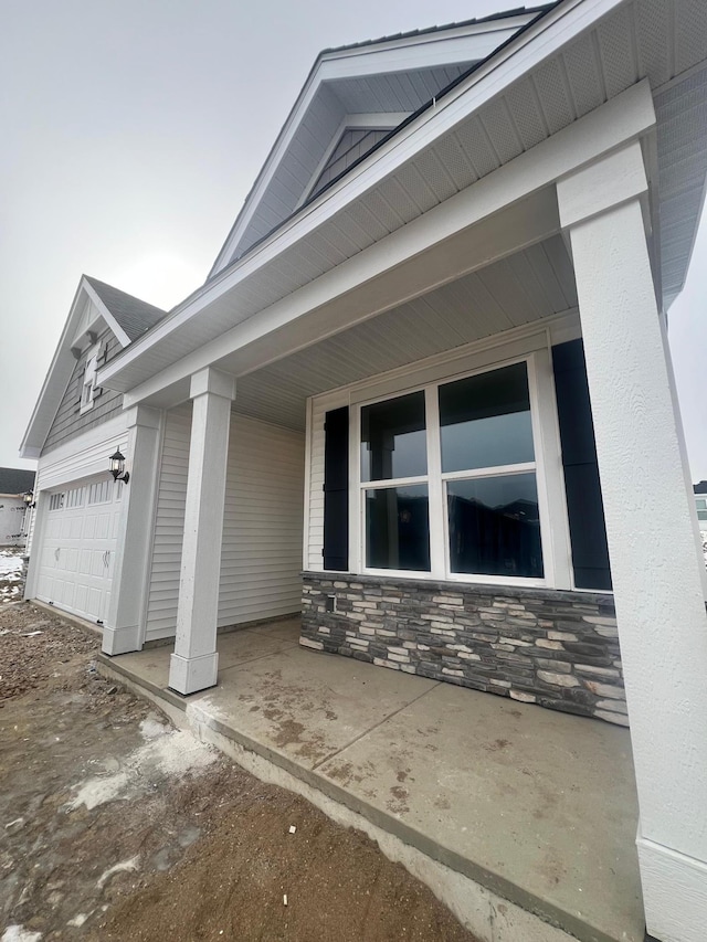 view of side of home featuring a garage