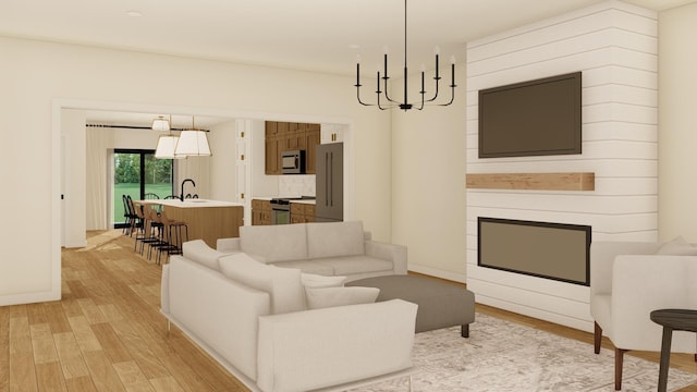 living room with sink, light hardwood / wood-style flooring, and a notable chandelier