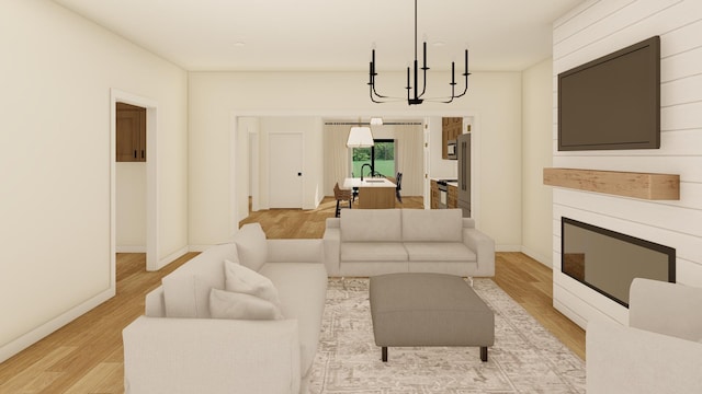 living room with light hardwood / wood-style floors and an inviting chandelier