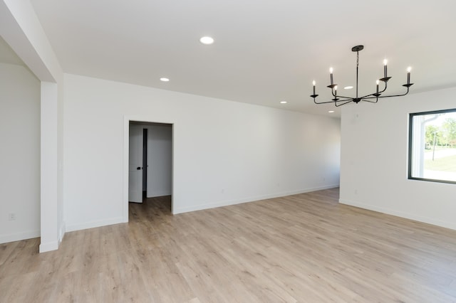 100 3rd Ave, Pelican Rapids, MN 56572 - empty room with a chandelier, recessed lighting, and light wood finished floors