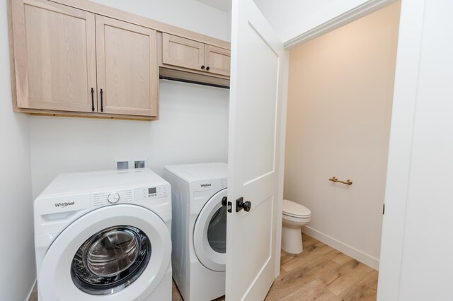 100 3rd Ave, Pelican Rapids, MN 56572 - laundry area featuring washing machine and clothes dryer and light wood-type flooring