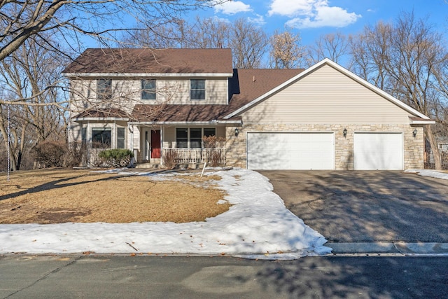 view of front of home featuring a garage and a porch