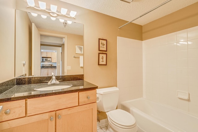 full bathroom featuring toilet, vanity, tile patterned flooring, a textured ceiling, and bathtub / shower combination