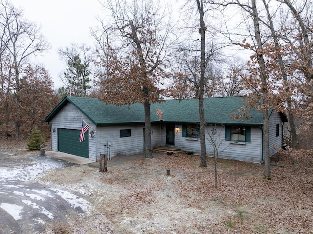 ranch-style home featuring a garage