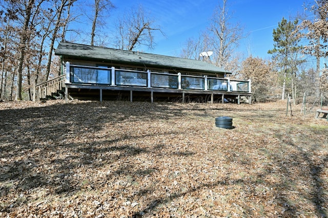 back of house with a wooden deck