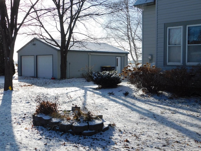 view of snow covered garage