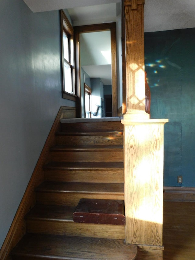 staircase featuring hardwood / wood-style flooring