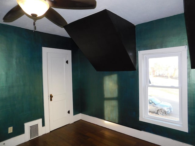 bonus room featuring ceiling fan and dark hardwood / wood-style flooring