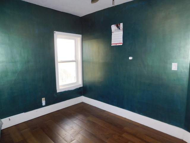 spare room featuring dark hardwood / wood-style flooring