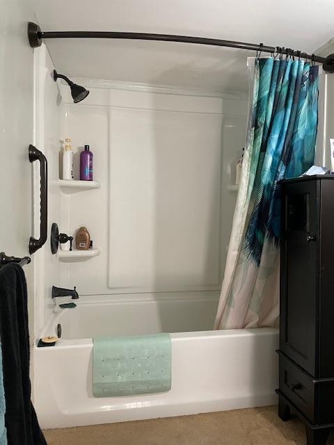 bathroom featuring vanity and shower / bath combo