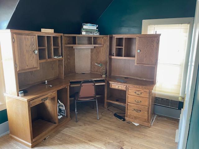 office area featuring vaulted ceiling and light hardwood / wood-style floors