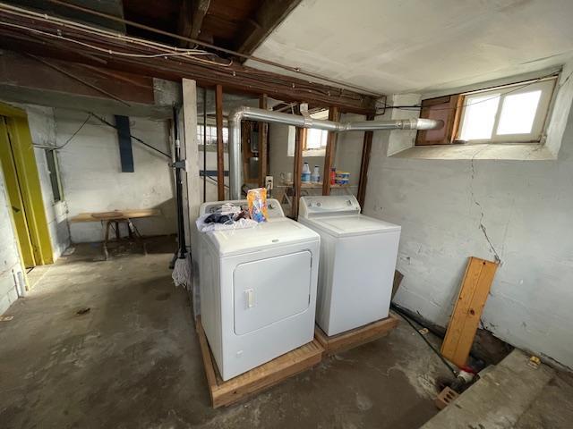 laundry area with washing machine and dryer