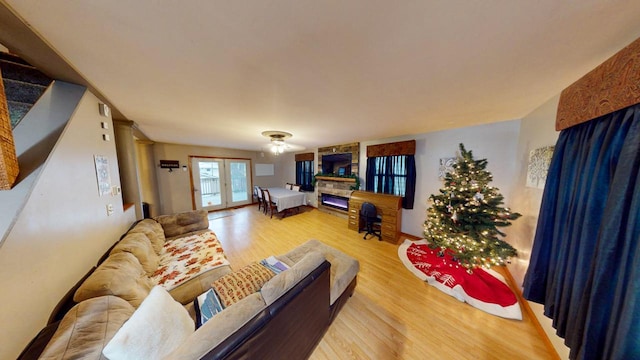 living room with french doors and light hardwood / wood-style floors