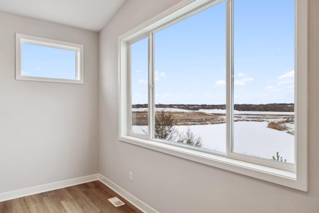 unfurnished room with hardwood / wood-style floors