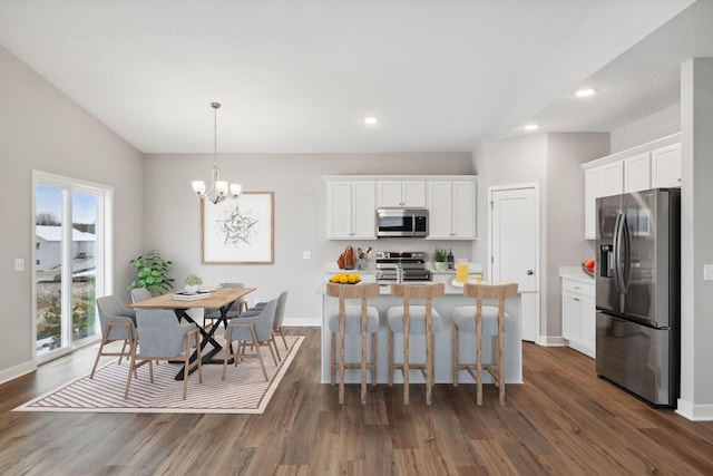 kitchen featuring a healthy amount of sunlight, white cabinets, and stainless steel appliances