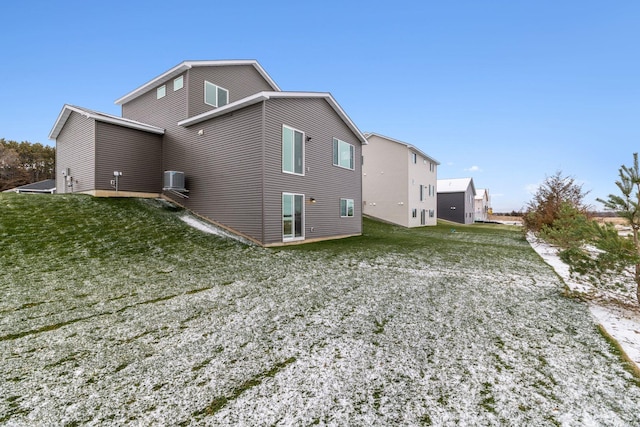 back of house with a lawn and cooling unit