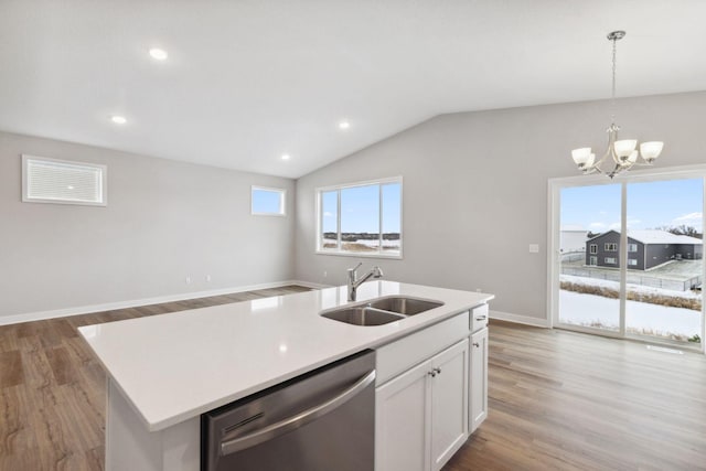 kitchen with dishwasher, sink, light hardwood / wood-style floors, a kitchen island with sink, and white cabinets