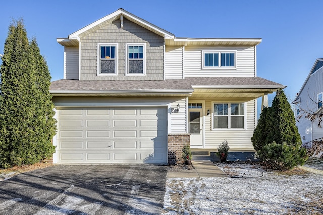 view of front of property with a garage