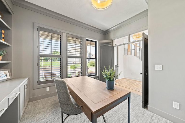 home office featuring crown molding and light carpet