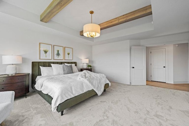 bedroom featuring beam ceiling and carpet flooring