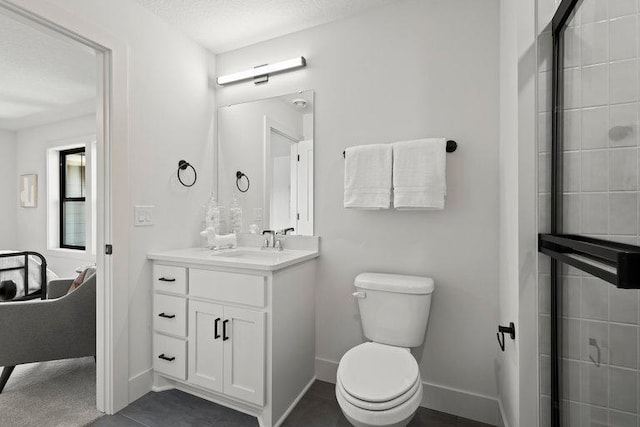 bathroom with tile patterned floors, an enclosed shower, a textured ceiling, vanity, and toilet