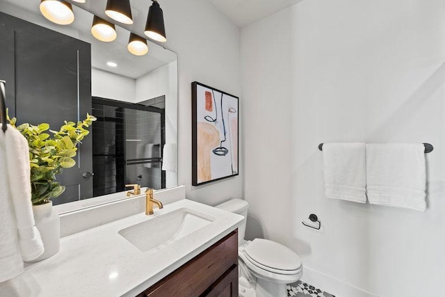 bathroom with tile patterned floors, vanity, toilet, and an enclosed shower