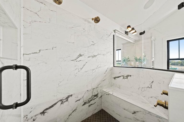 full bathroom featuring a tile shower