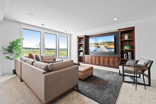 living room with light colored carpet, a textured ceiling, and baseboards