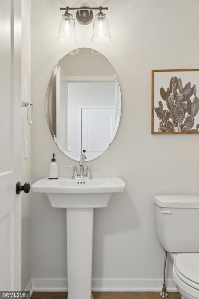 bathroom with toilet and sink