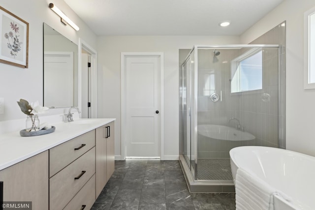 bathroom featuring vanity and an enclosed shower