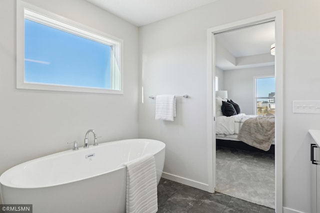 bathroom with a bath and vanity