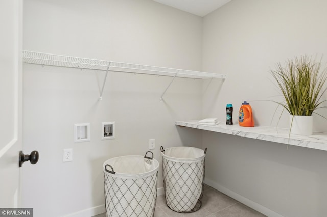 laundry area featuring washer hookup and light tile patterned flooring