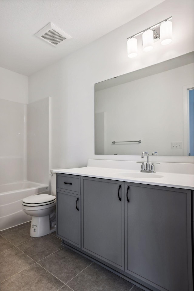 full bathroom featuring tile patterned flooring, vanity, shower / bathtub combination, and toilet