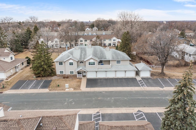 birds eye view of property with a residential view