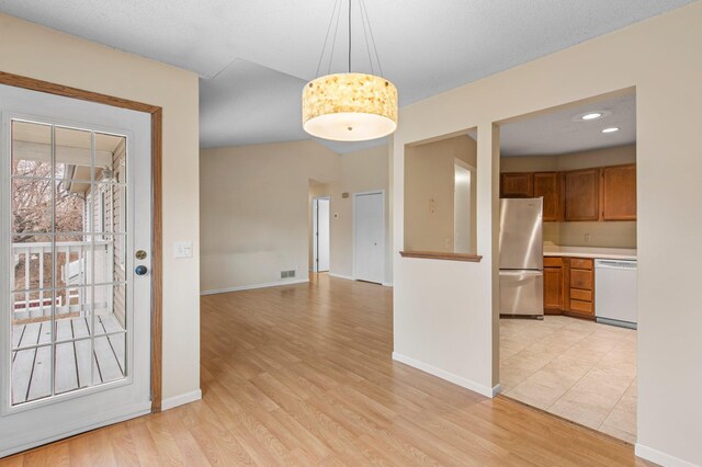 interior space with visible vents, recessed lighting, light wood-style floors, and baseboards