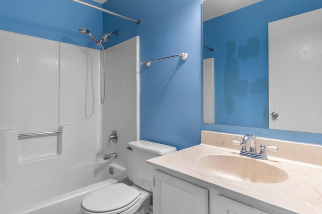 bathroom featuring vanity, toilet, and shower / washtub combination