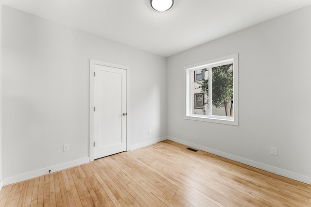 unfurnished room featuring light wood-type flooring