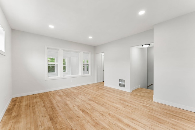 unfurnished room with light hardwood / wood-style floors