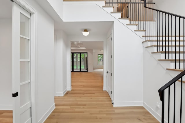 4023 Beard Ave S, Minneapolis, MN 55410 - hallway with light wood-type flooring and stairway