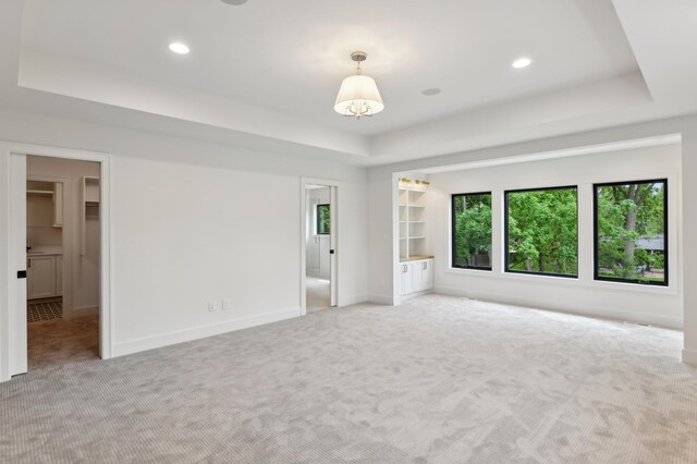 4023 Beard Ave S, Minneapolis, MN 55410 - unfurnished bedroom featuring a raised ceiling, light colored carpet, recessed lighting, and a spacious closet