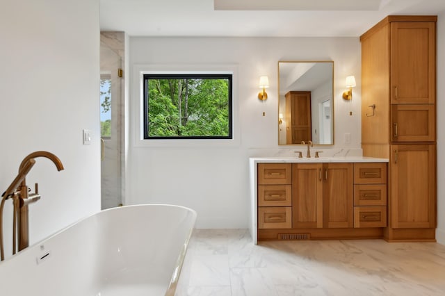 4023 Beard Ave S, Minneapolis, MN 55410 - bathroom featuring marble finish flooring, a soaking tub, vanity, and a shower with door