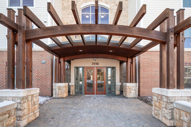 view of exterior entry featuring french doors