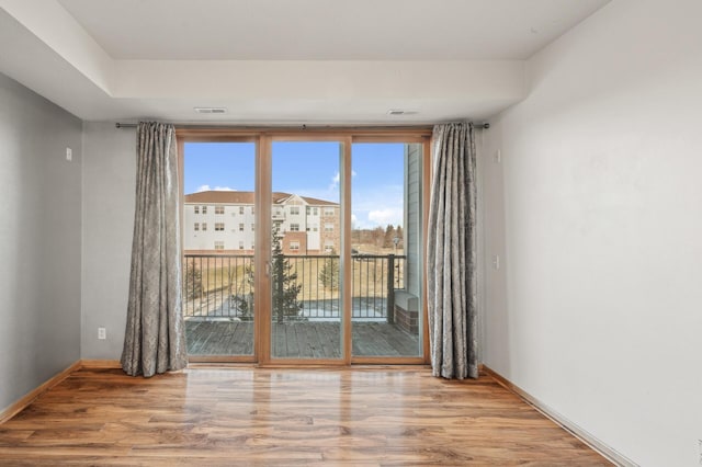 spare room featuring light wood-type flooring