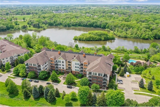 birds eye view of property with a water view