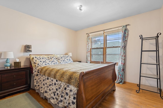 bedroom with light wood-type flooring