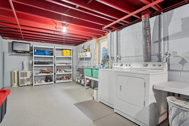 laundry area with separate washer and dryer