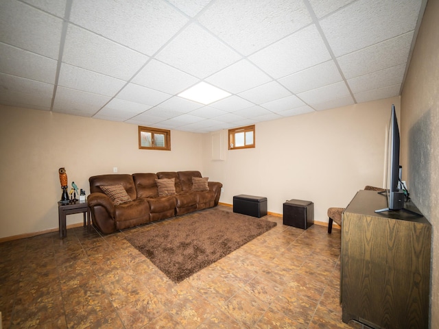 living room featuring a paneled ceiling