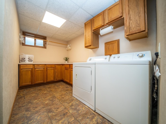 washroom with cabinets and independent washer and dryer