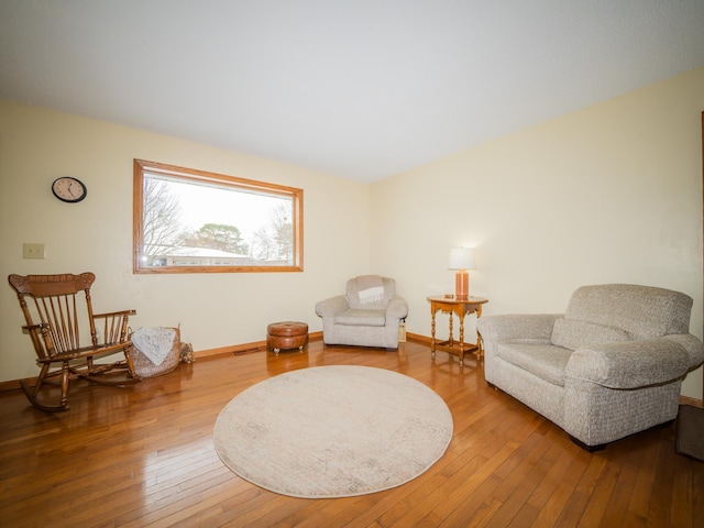 sitting room with hardwood / wood-style floors