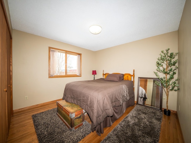 bedroom featuring hardwood / wood-style flooring